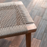 Beige wooden stool with woven recycled paper seat