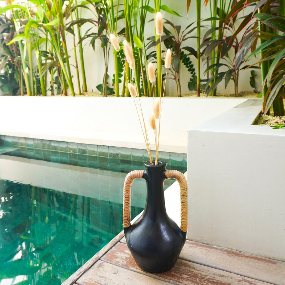 Black clay bottle vase with rattan-wrapped handles