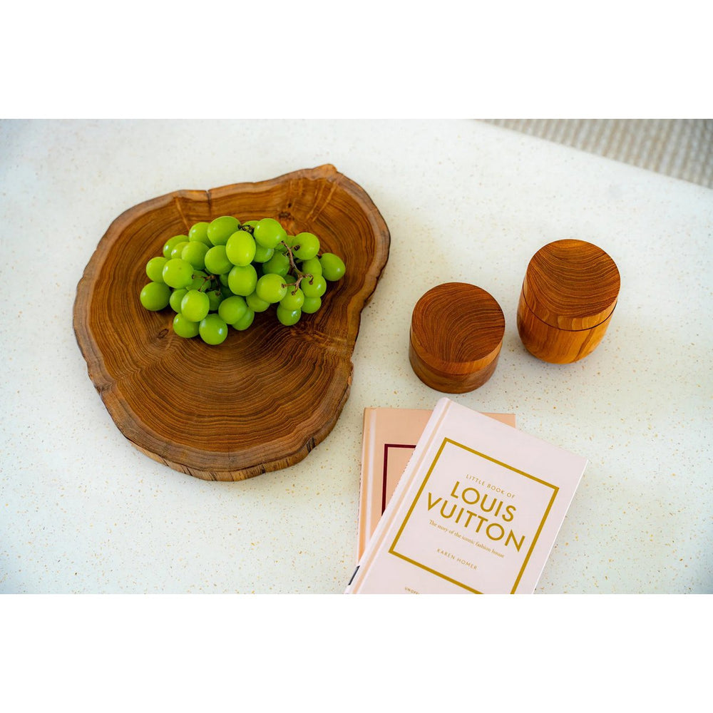 Brown teak wood cutting board with natural root shape