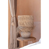 Beige and grey terracotta table lamp with rattan grid and fringed grass shade