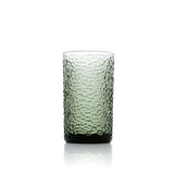 Green textured glass tumbler on a white background