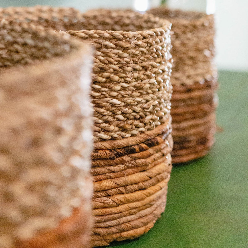 Two-tone brown and beige woven seagrass and banana fibre basket