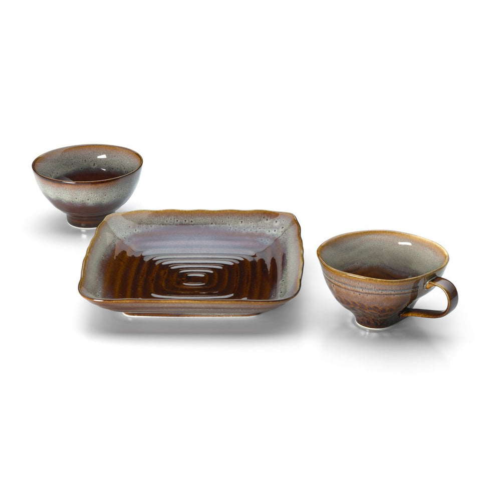 Set of ceramic bowls and a rectangular dish on a white background