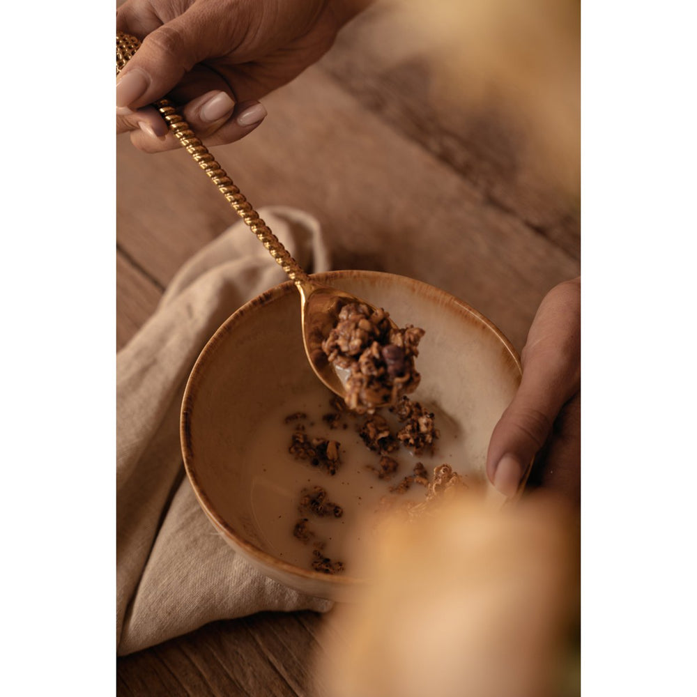White stoneware cereal bowl with cinnamon-toned drip glaze