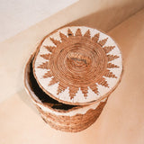 Brown woven banana fibre laundry basket with lid and white cotton macrame pattern