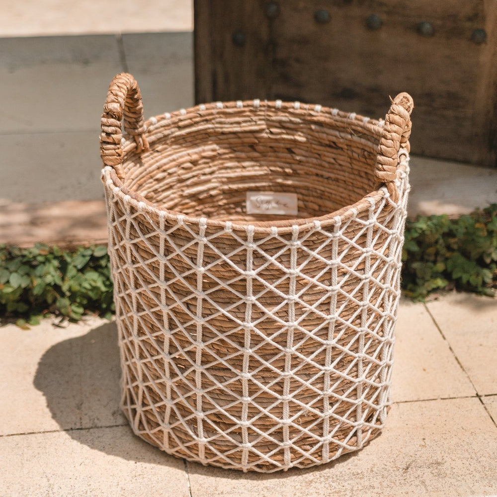 Brown banana fibre basket with white cotton woven pattern