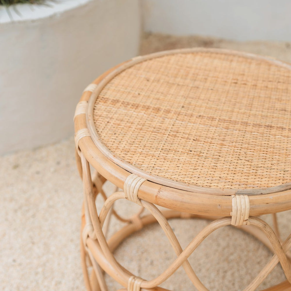Beige round rattan side table