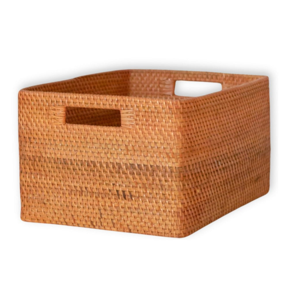 Woven brown storage basket with handles on a white background