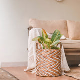 White and beige woven water hyacinth basket with striped pattern