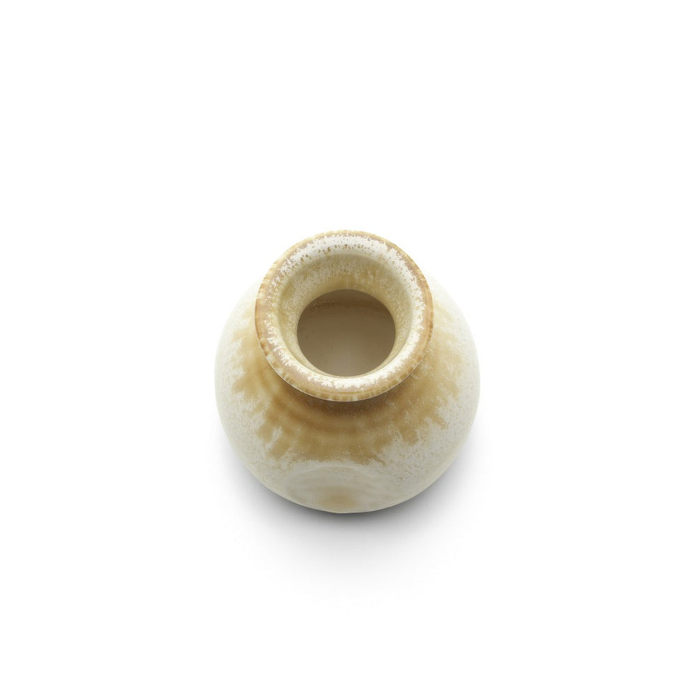 Beige ceramic sauce pourer with white honey glaze