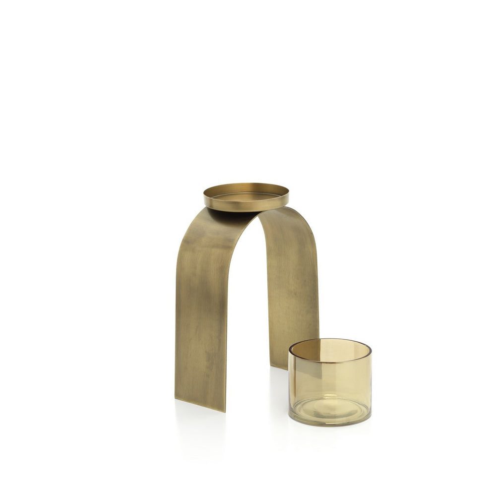 Brass candle holder with a glass candle on a white background