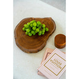 Brown teak wood cutting board with natural root shape