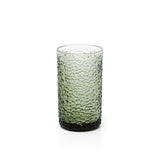 Green textured glass tumbler on a white background