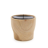 Wooden candle holder with a candle on a white background
