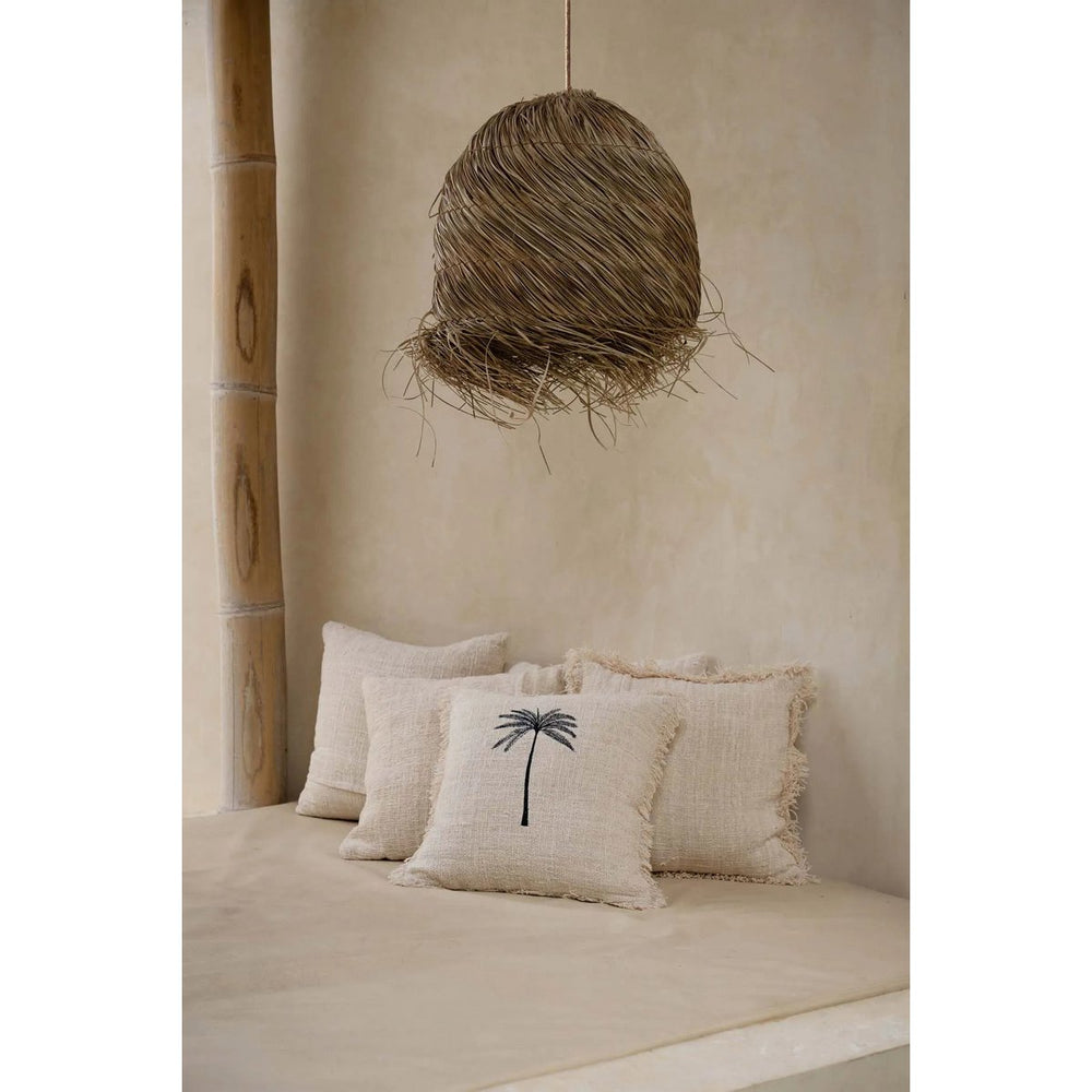 Black woven cotton cushion cover with palm leaf design