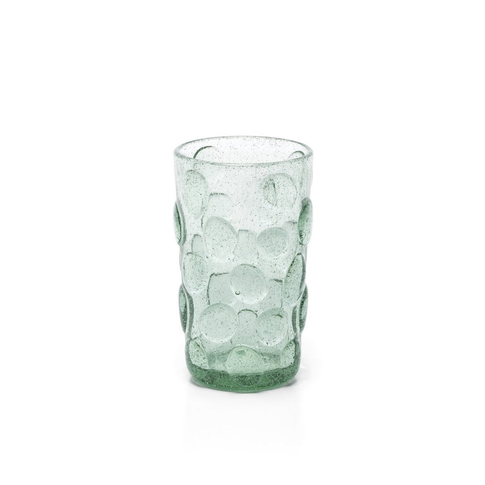 Green textured glass tumbler on a white background