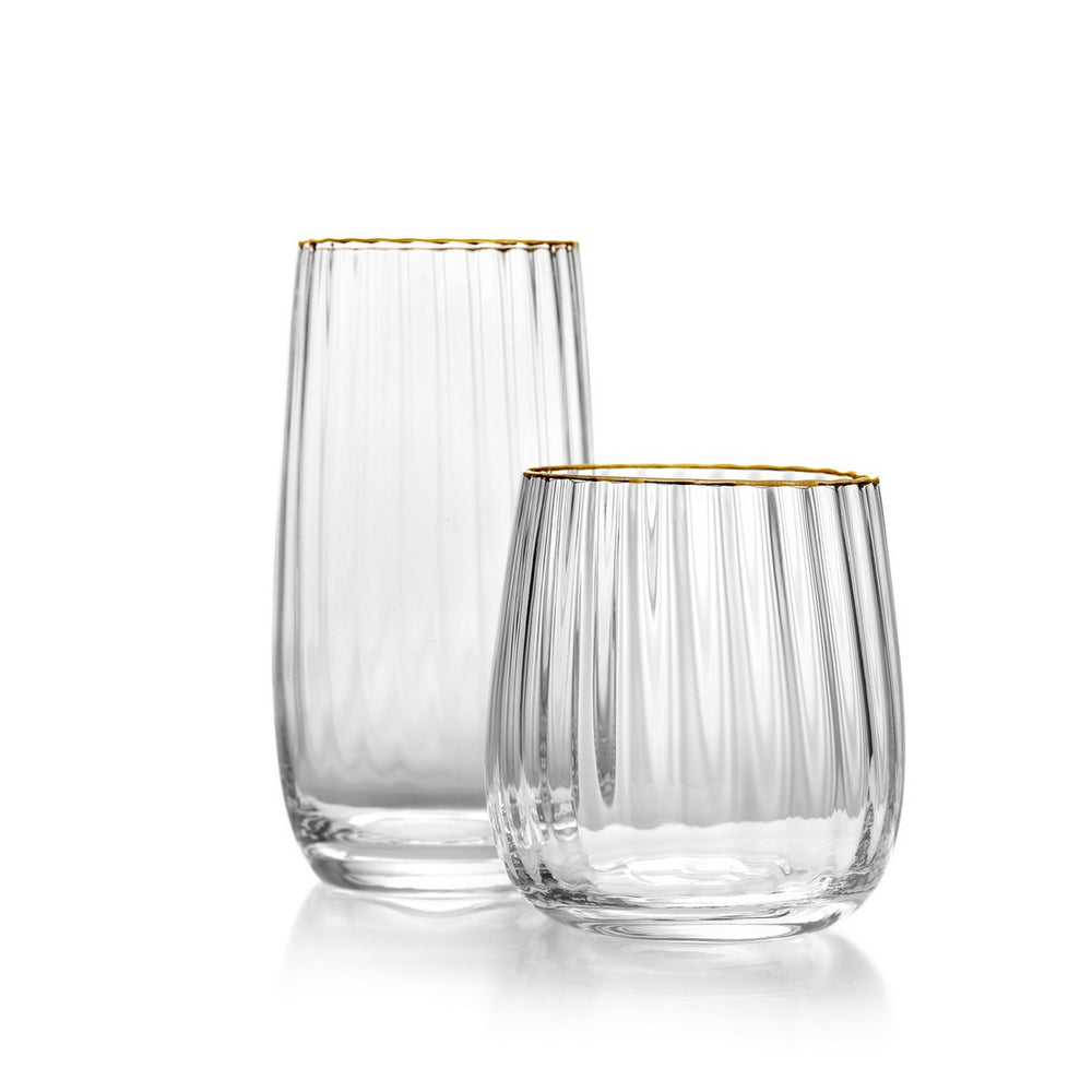 Two clear glass tumblers with gold rims on a white background