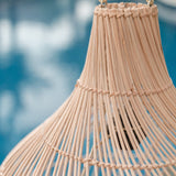 Beige rattan pendant lamp with braided boho design