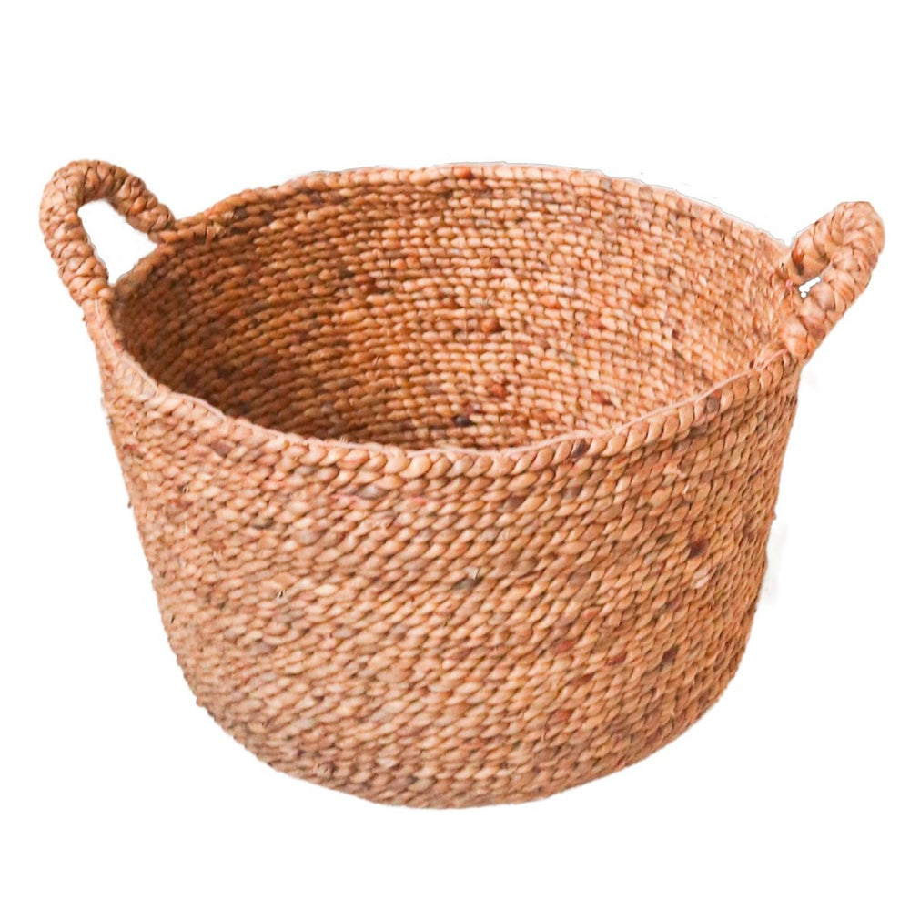 Woven basket with handles on a white background