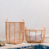 Beige woven rattan laundry basket with handles
