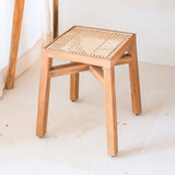 Brown wooden stool with woven rattan seat
