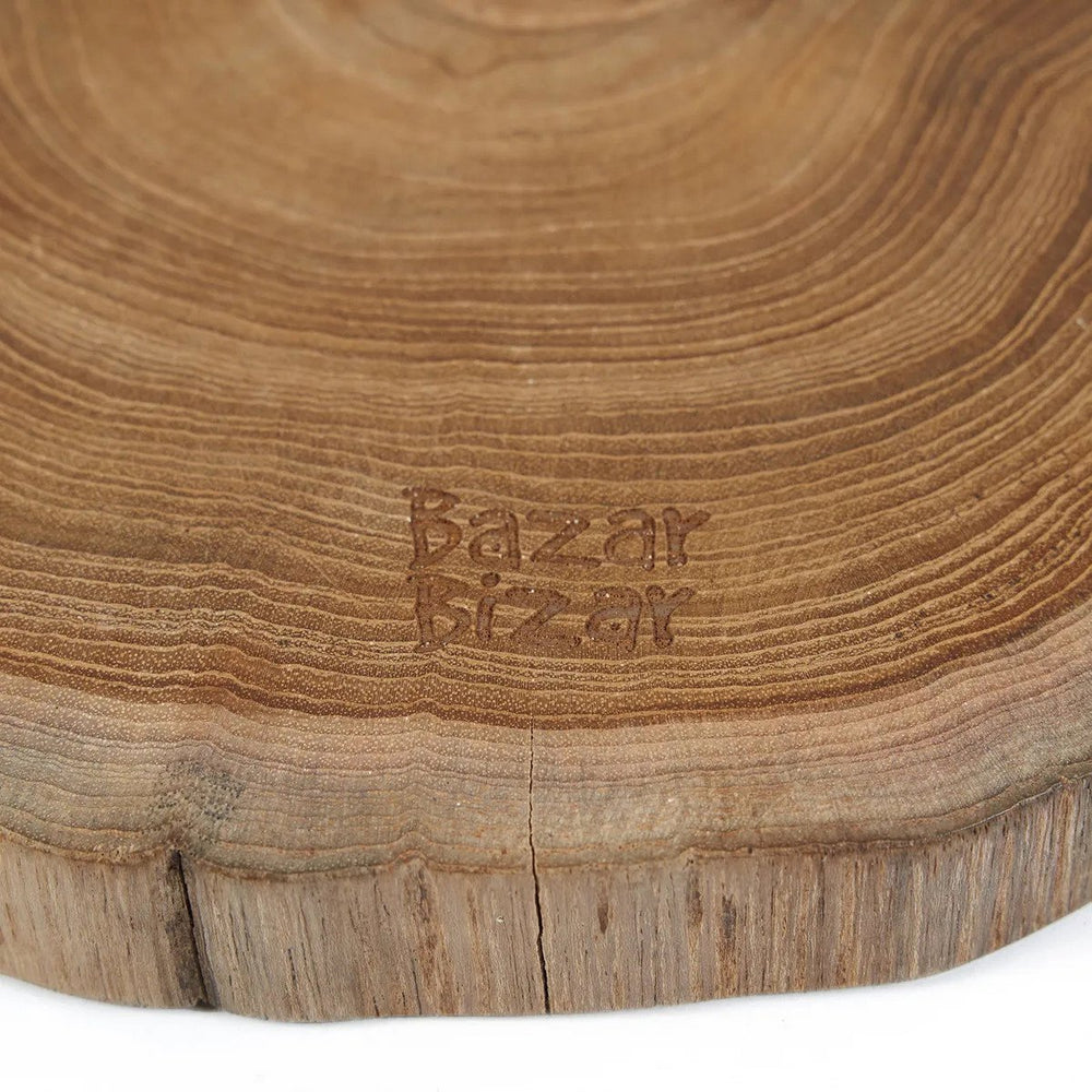 Brown teak wood cutting board with natural root shape