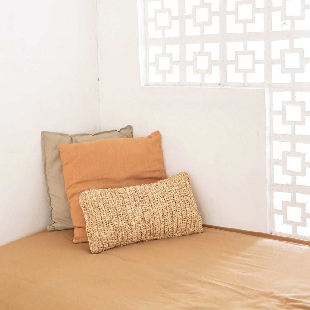 Beige raffia throw pillow