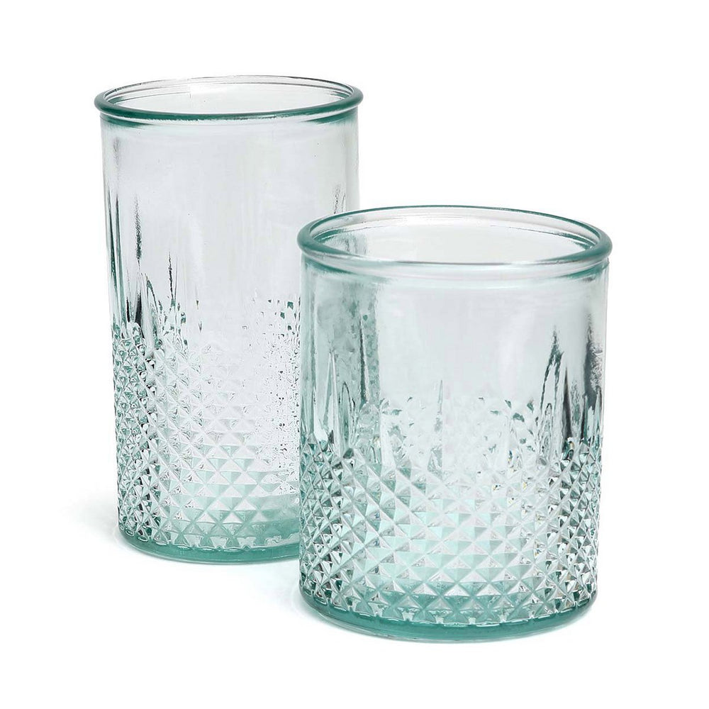 Two textured glass tumblers on a white background