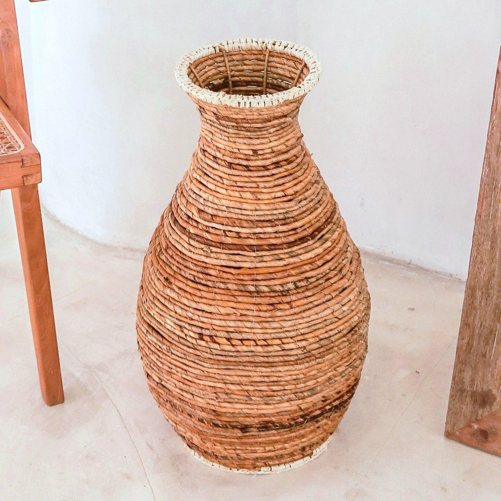 Beige and brown handwoven banana fiber vase with raffia accents