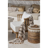 White fringed cotton throw with charcoal stripes and terracotta tassels