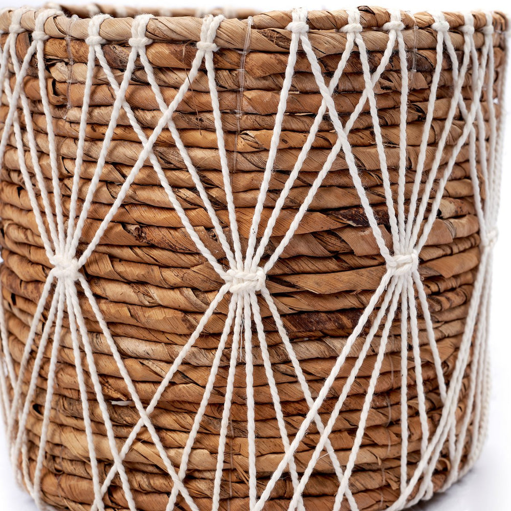 Brown and white woven banana fibre storage basket with cotton macramé lacing