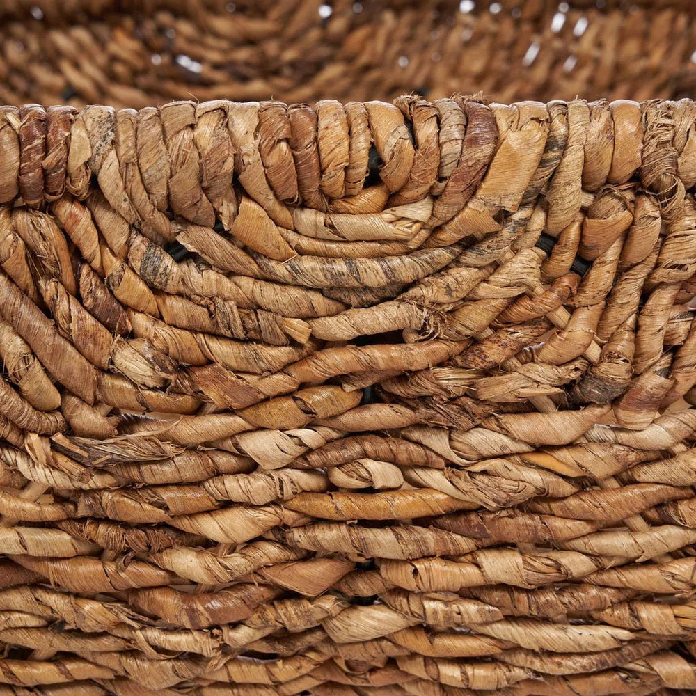 Brown woven palm leaf storage basket with handles