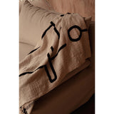 Black cotton throw with Evil Eye design