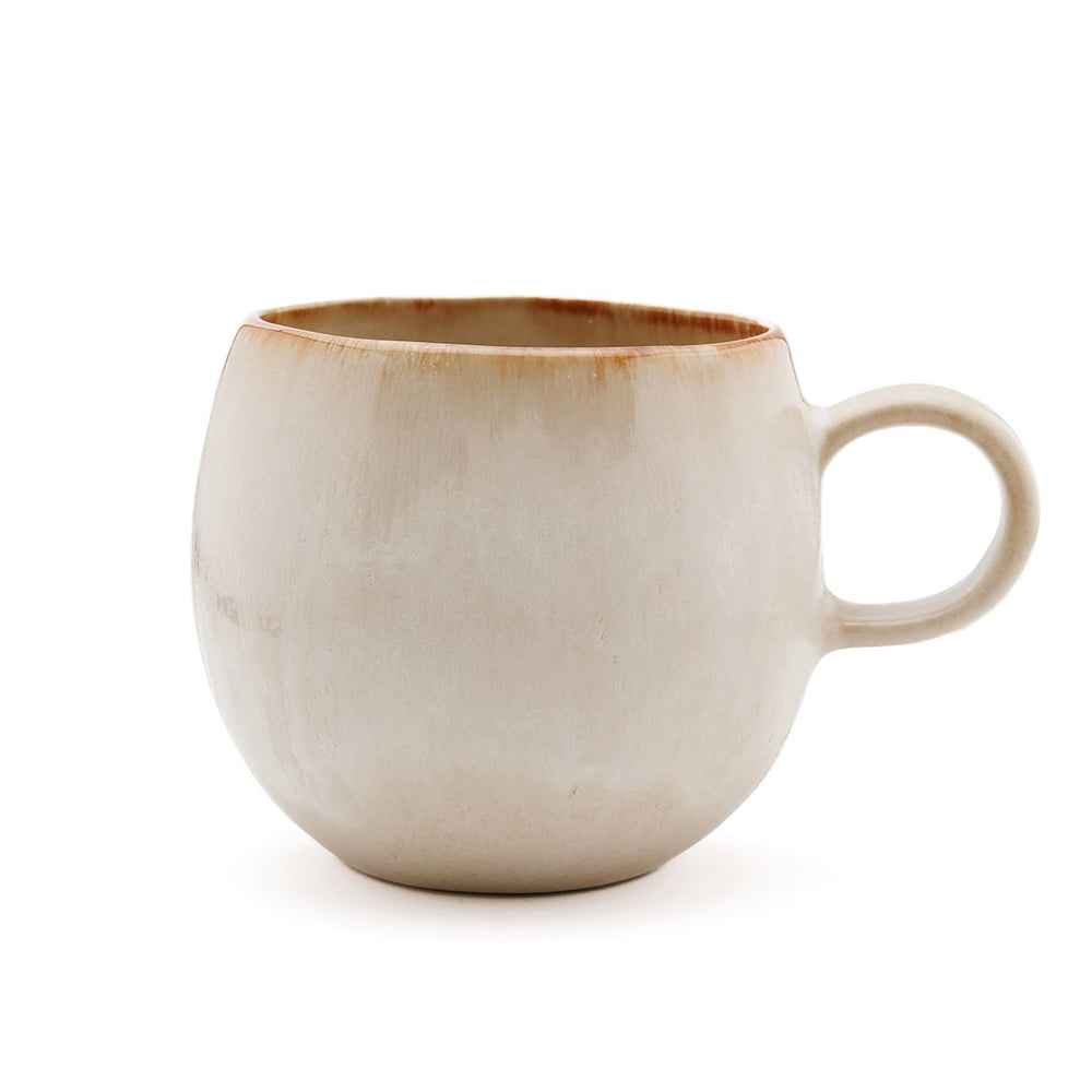 Beige ceramic mug on a white background