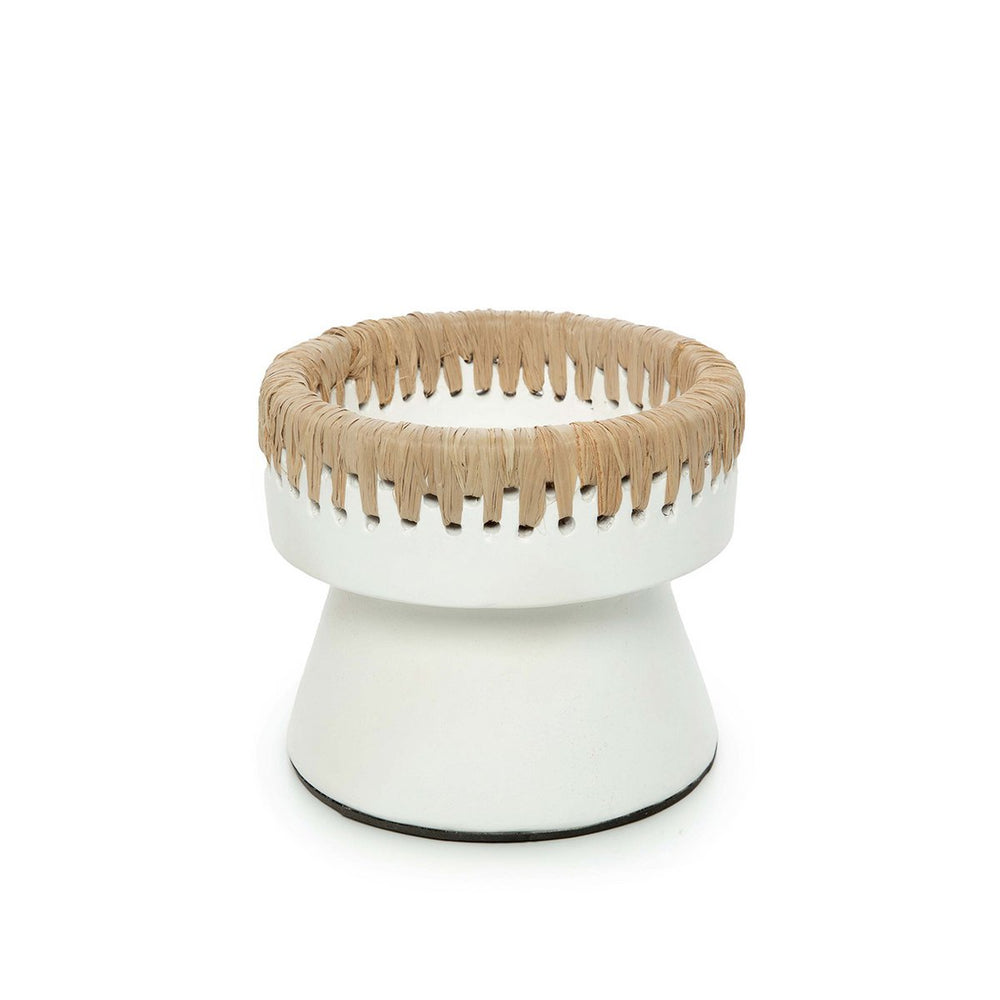 White pedestal with woven top on a white background