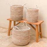Beige woven banana fibre storage basket with white cotton cord pattern