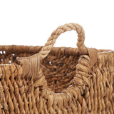 Brown woven palm leaf storage basket with handles