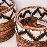 Brown woven banana fibre basket with zigzag pattern