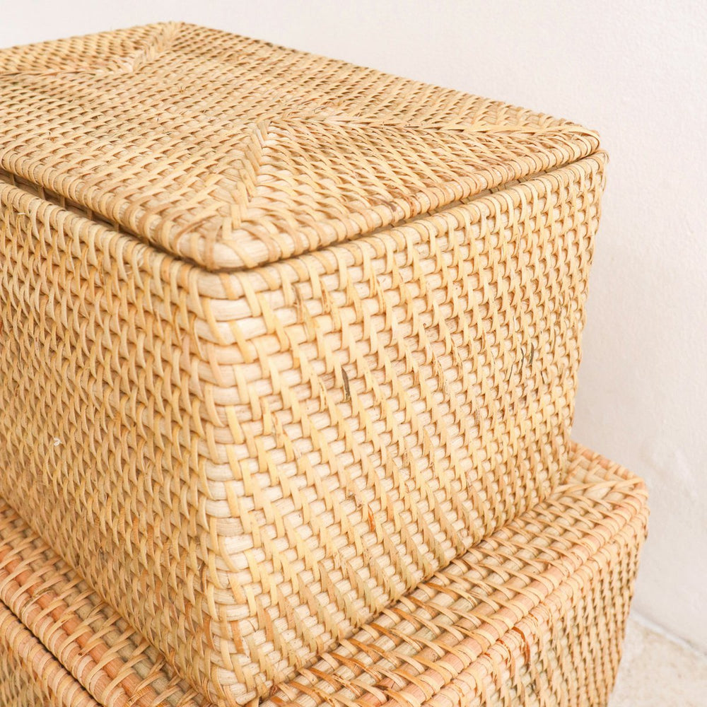 Woven storage basket with a lid on a white background