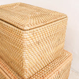 Woven storage basket with a lid on a white background