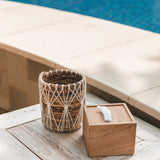 Brown and white woven banana fibre storage basket with cotton macramé lacing