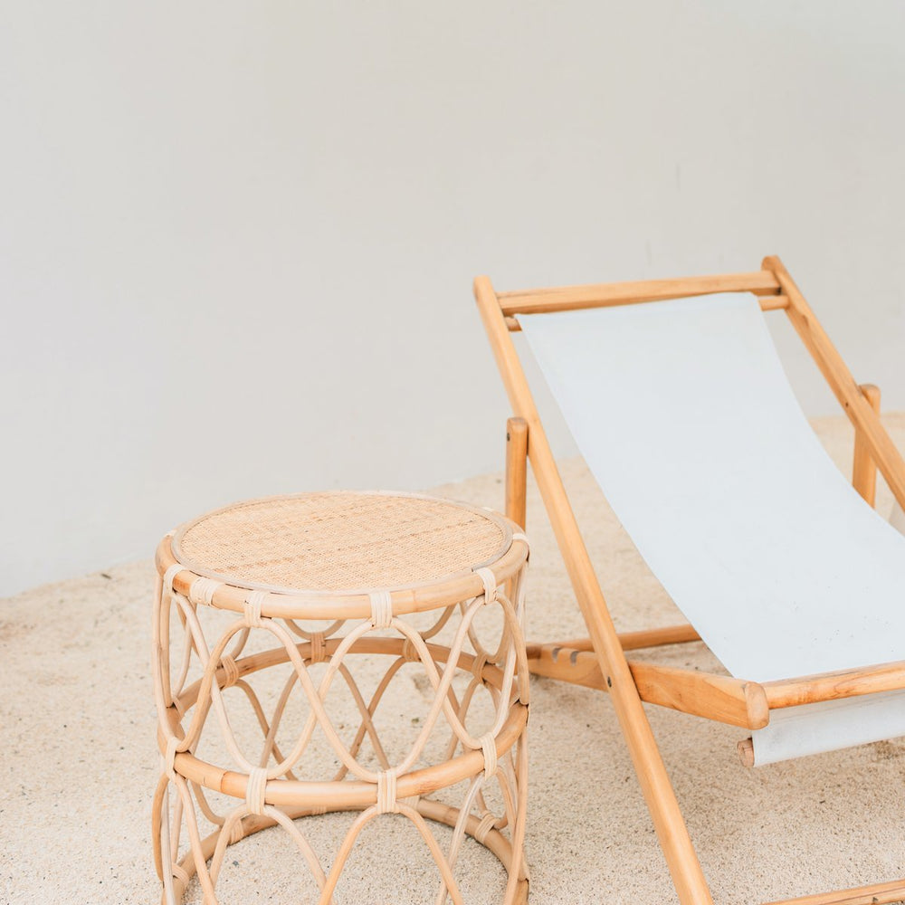 Beige round rattan side table