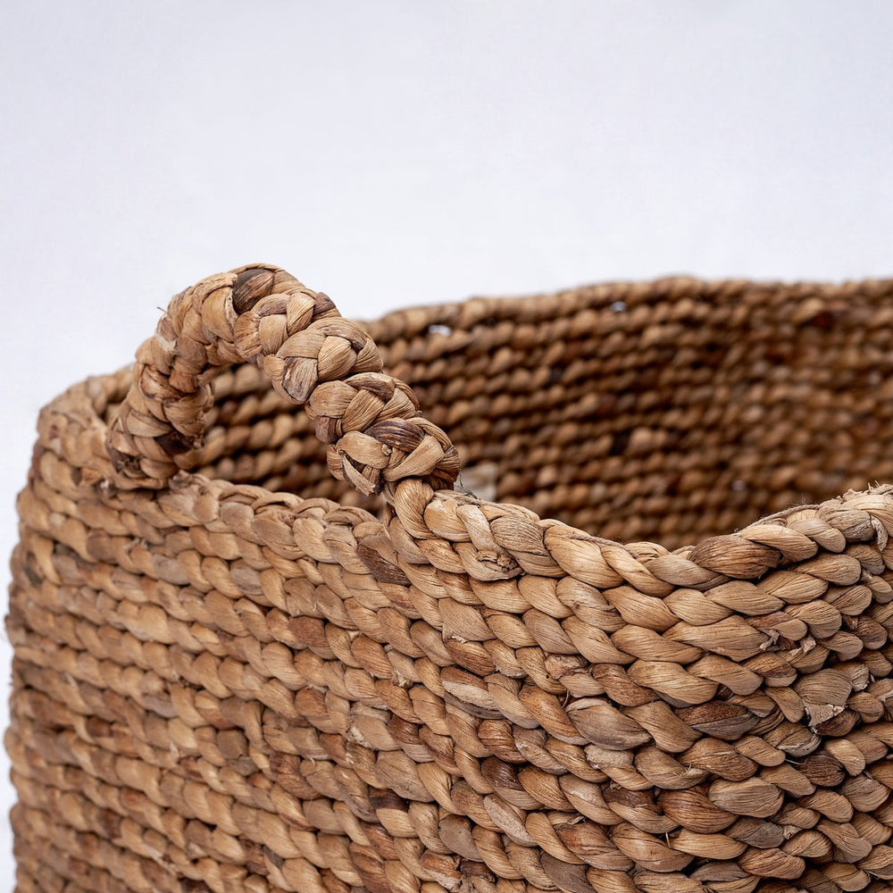 Close-up of a woven basket with a white background