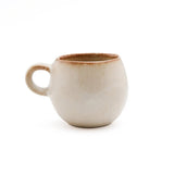 Beige stoneware espresso cup