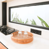 Beige round bamboo serving tray