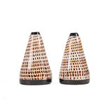 Two cone-shaped ceramic vases with a patterned design on a white background