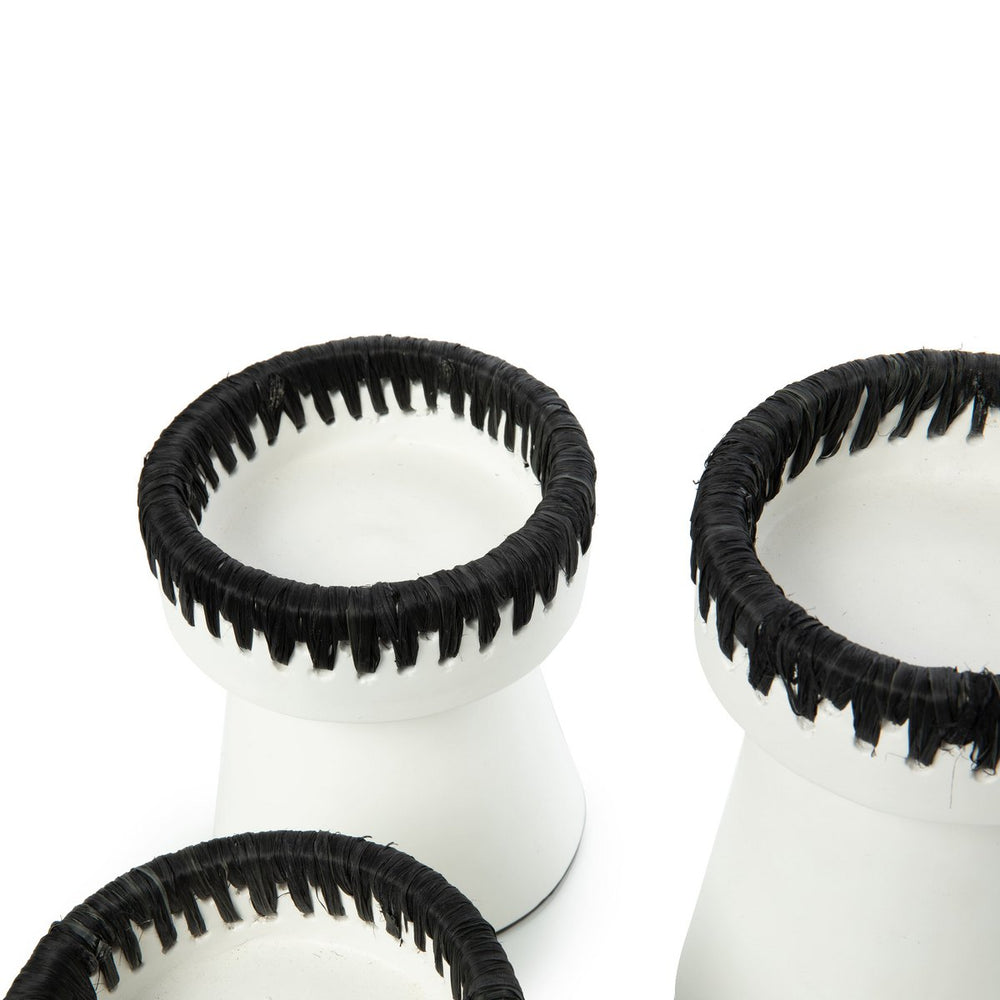 White and black terracotta candle holder with raffia trim