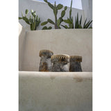 Antique grey terracotta candle holder with raffia accent