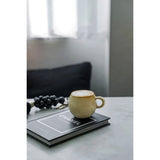 Beige stoneware espresso cup