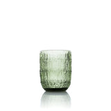 Green textured glass tumbler on a white background